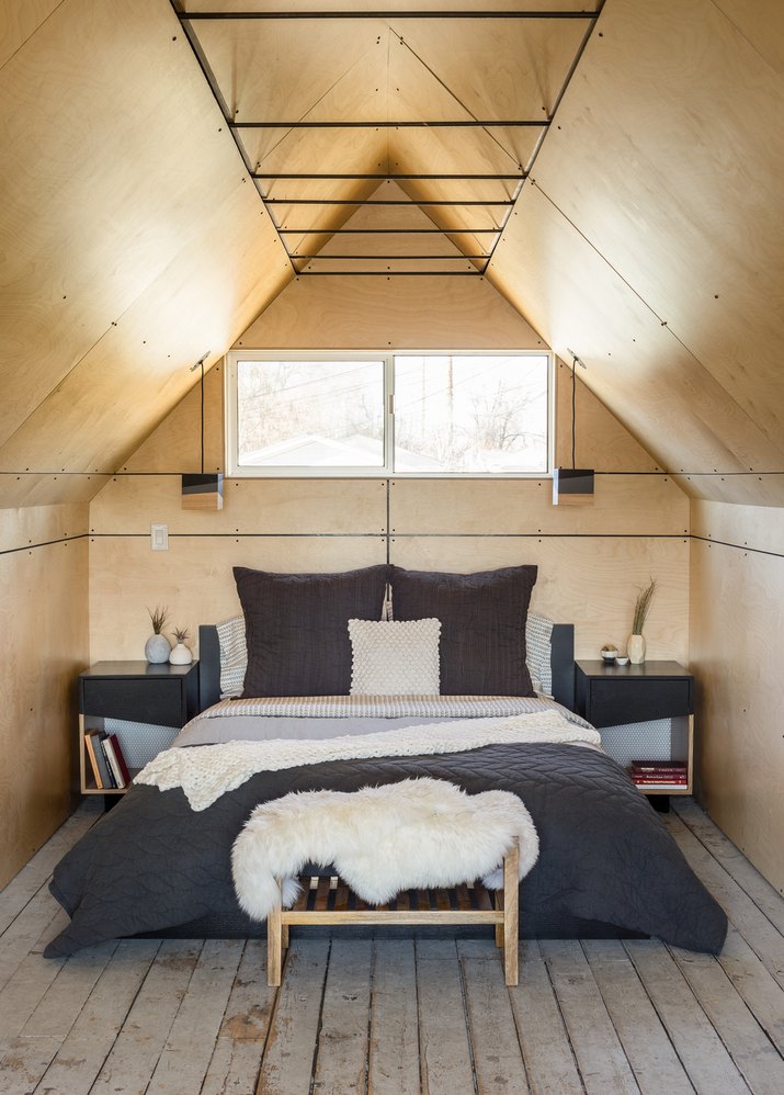 small bedroom with birch panels