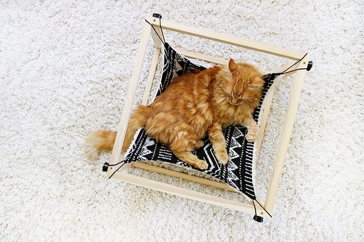 DIY kitty hammock made with wood and double-sided fabric