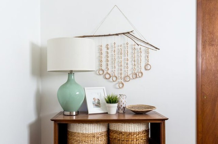 A DIY wood wall hanging will add interest to blank walls