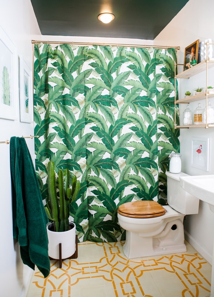 bathroom with stenciled tile and unique shower curtain