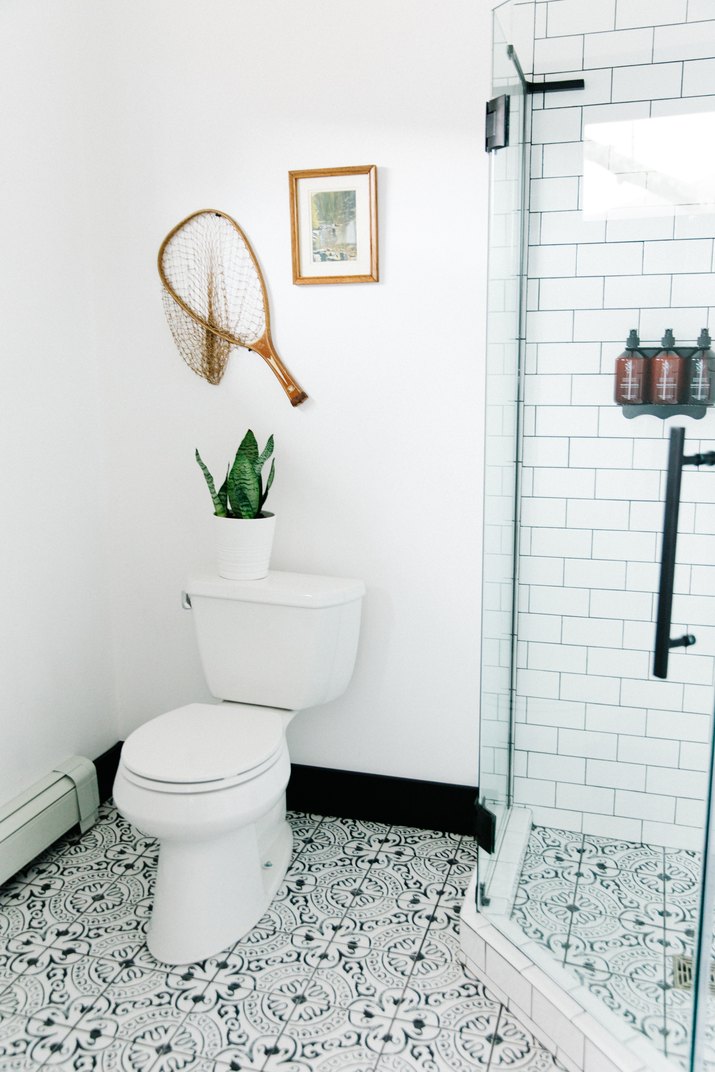 patterned bathroom tile with glass shower