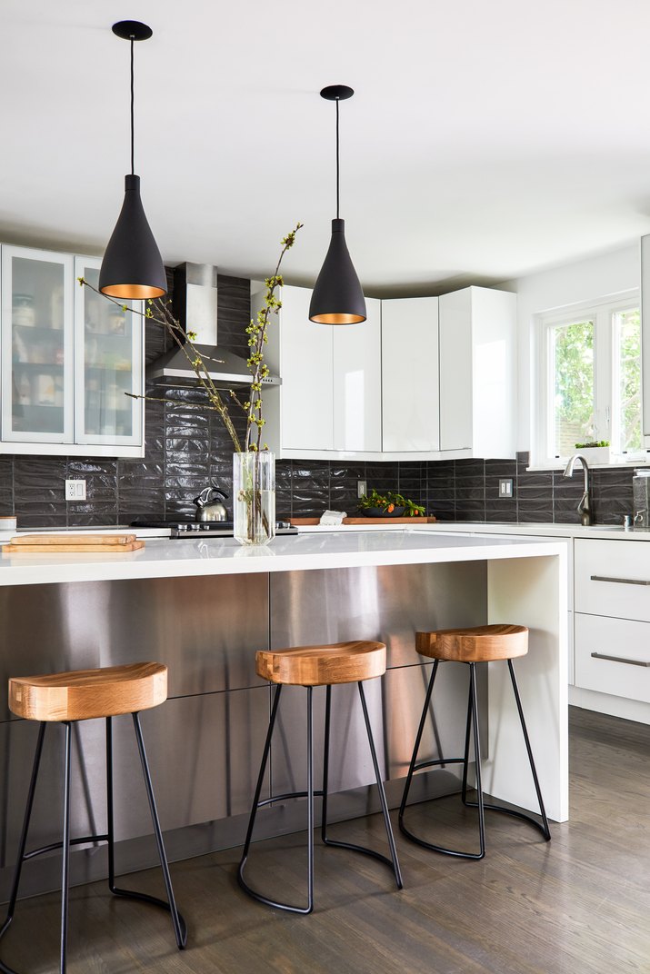 Contemporary kitchen with black tile backspash