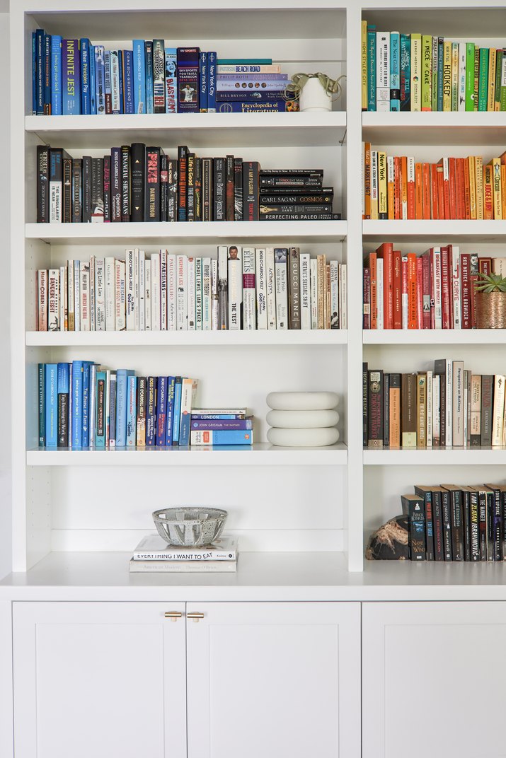 Built-in bookshelf with color-coded books