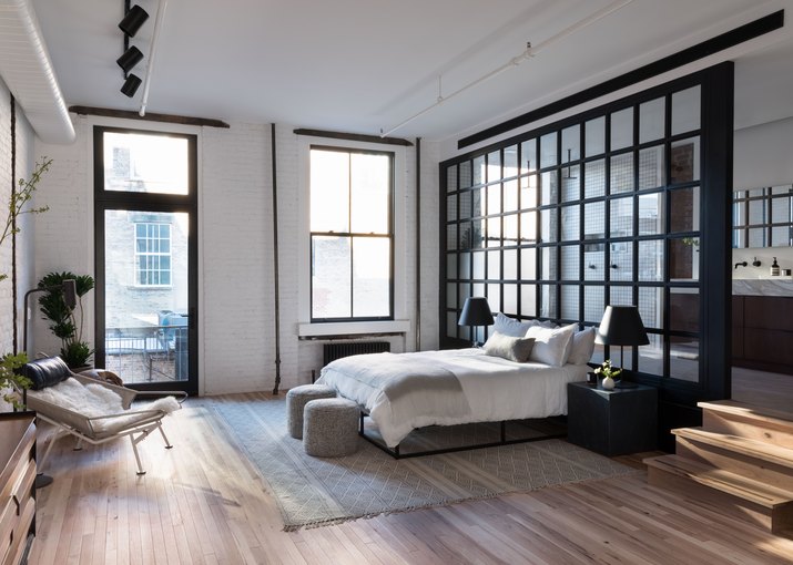 industrial bedroom with glass wall partition