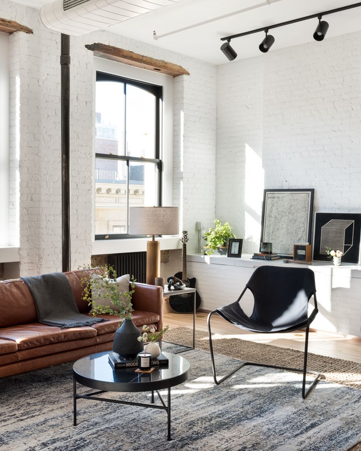 living room with white brick walls
