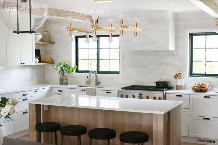 kitchen with modern chandelier and white subway tile