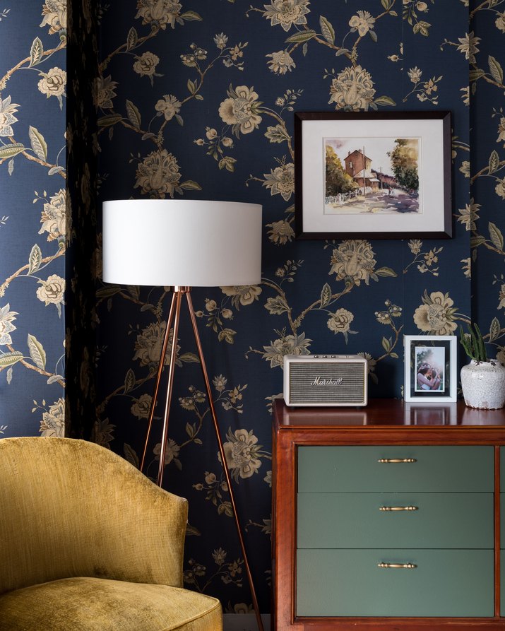 bedroom with navy floral wallpaper