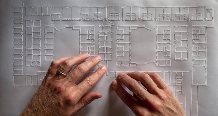 architect chris downey's hands feeling a tactile drawing