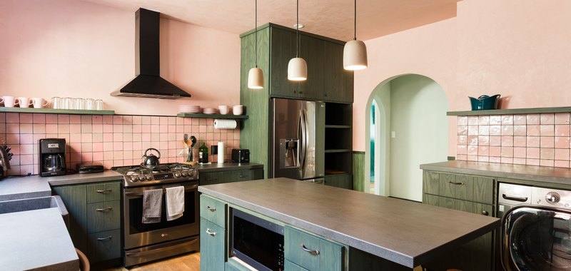 pink kitchen color idea with green cabinets and gray countertops
