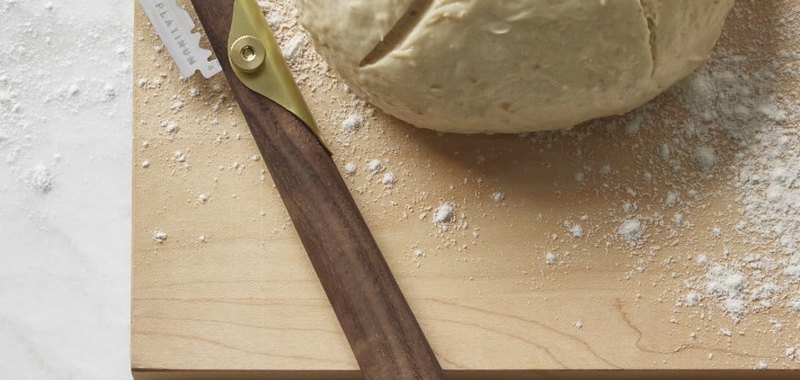 bread lame with dough nearby