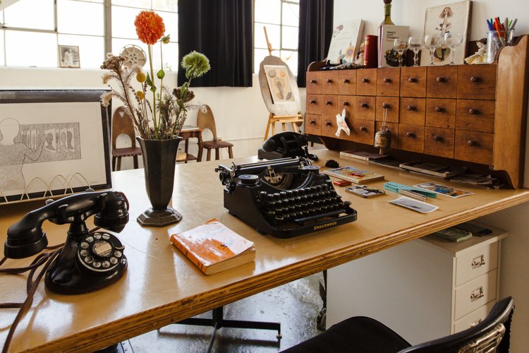 desk with typewriter and phone